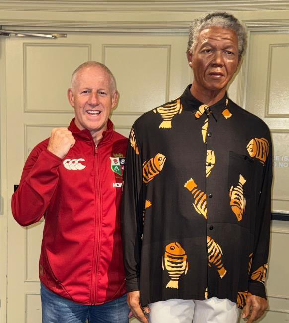 Tudor posing with a wax-work of Nelson Mandela